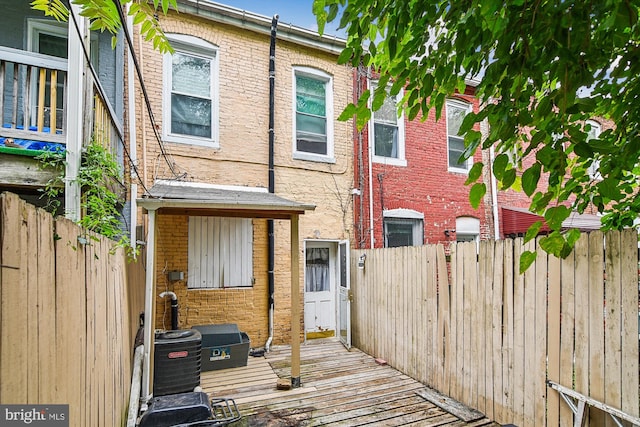 rear view of property with a wooden deck