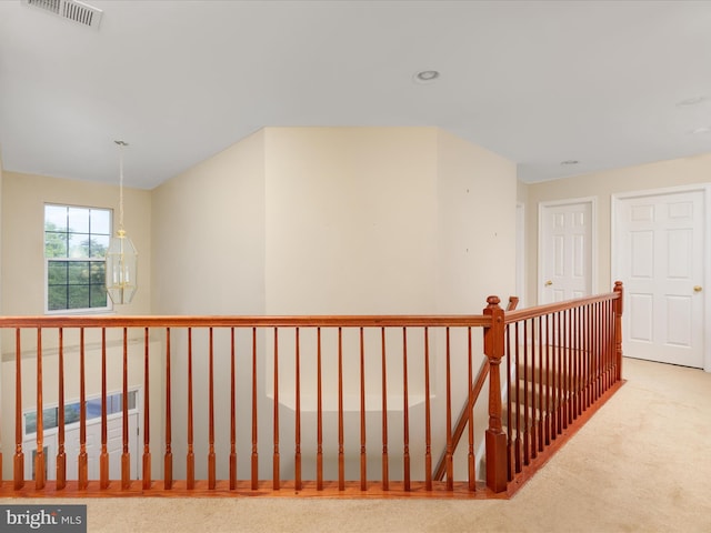 hallway with light carpet