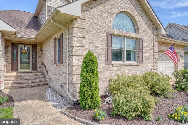 property entrance with a garage