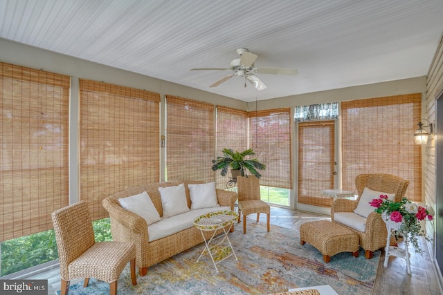 sunroom featuring ceiling fan