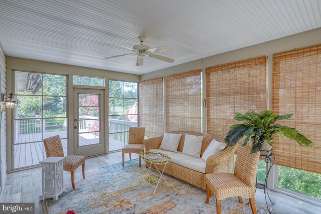 sunroom / solarium with ceiling fan