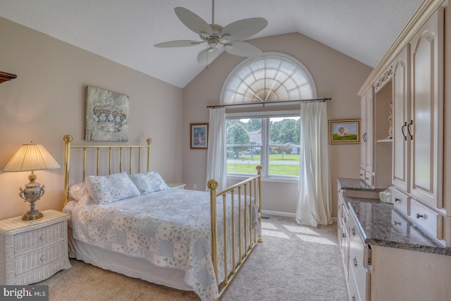 carpeted bedroom with ceiling fan and lofted ceiling