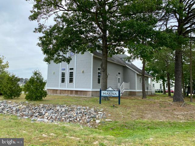 view of property exterior featuring a lawn