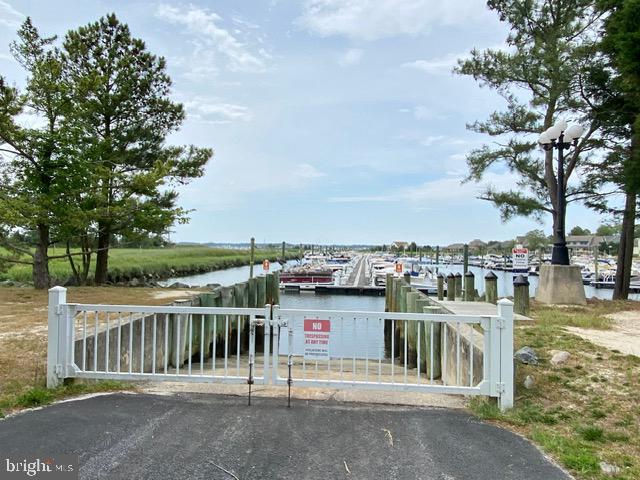 view of gate with a water view