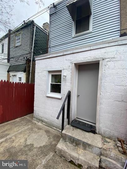 entrance to property with a patio