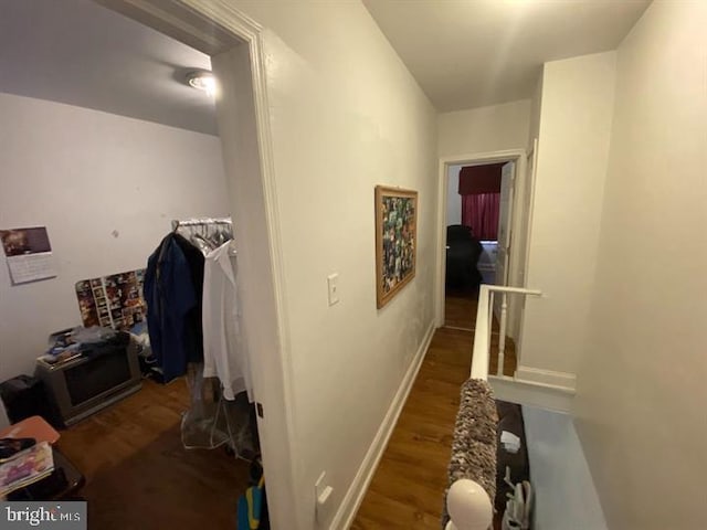 hallway with dark wood-type flooring