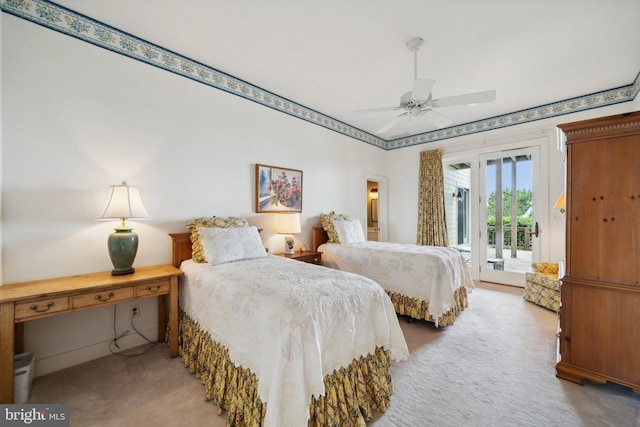 living room featuring a baseboard heating unit, light carpet, and ceiling fan