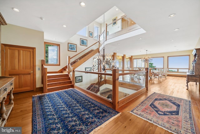 carpeted bedroom with ceiling fan and baseboard heating