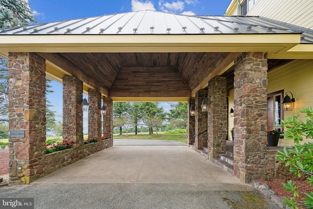 entrance foyer featuring carpet flooring, a baseboard heating unit, and high vaulted ceiling