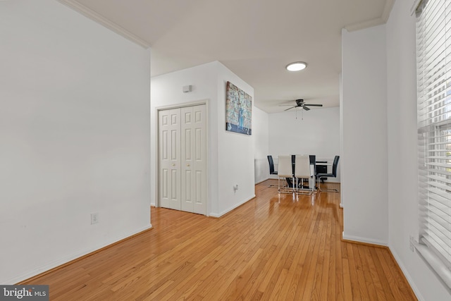 interior space featuring ornamental molding and light hardwood / wood-style floors