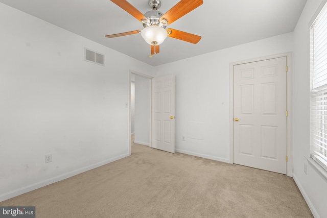 unfurnished bedroom with light carpet and ceiling fan