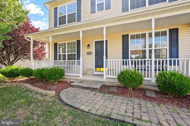 entrance to property with covered porch