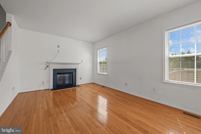 unfurnished living room featuring light hardwood / wood-style flooring