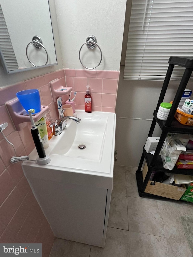 bathroom with vanity, decorative backsplash, and tile patterned flooring