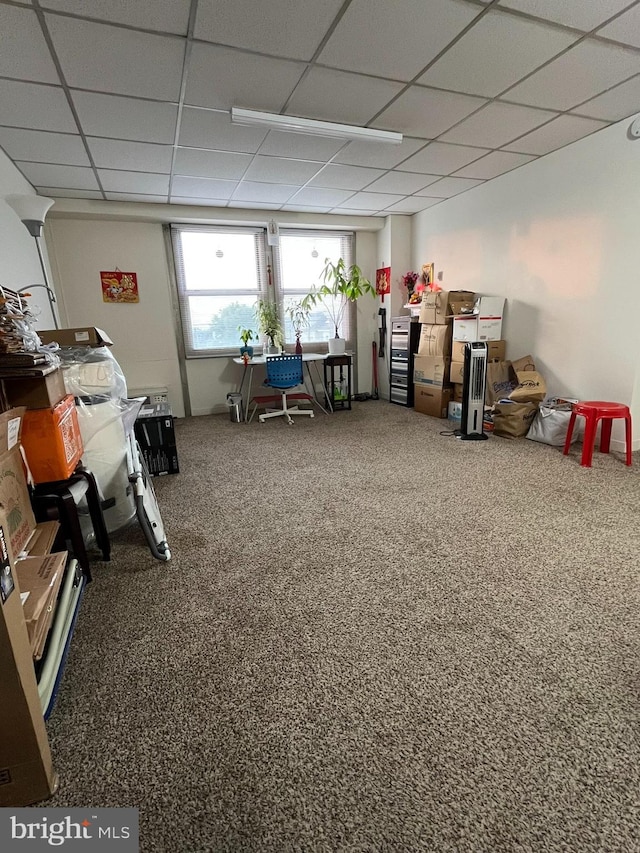 rec room featuring carpet flooring and a paneled ceiling