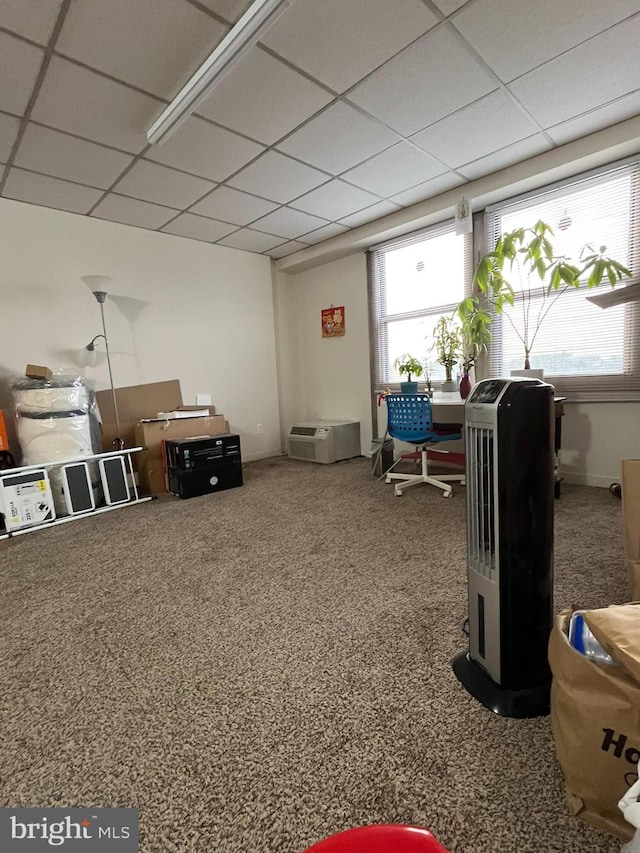 office area with carpet and a paneled ceiling