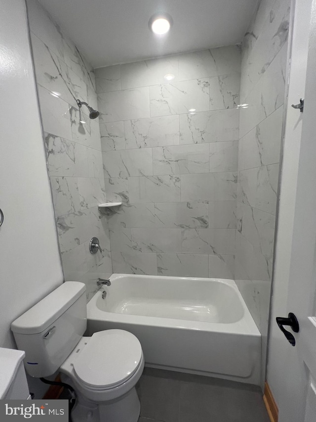 bathroom featuring toilet and  shower combination