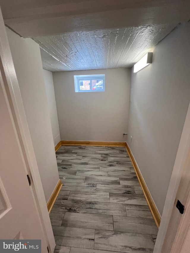 basement featuring hardwood / wood-style flooring