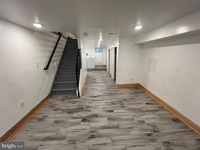 basement with hardwood / wood-style flooring