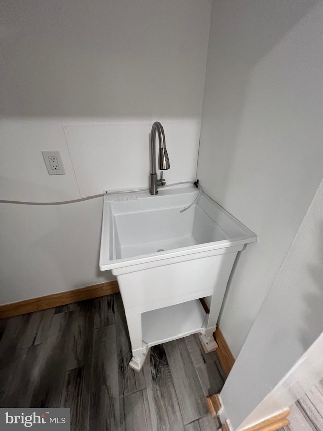 bathroom with sink and wood-type flooring