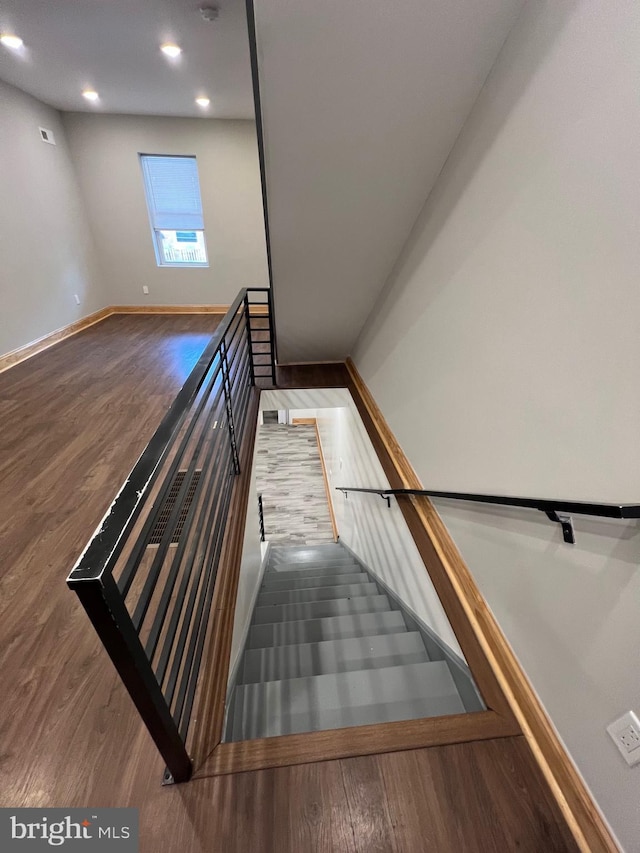 stairs with wood-type flooring