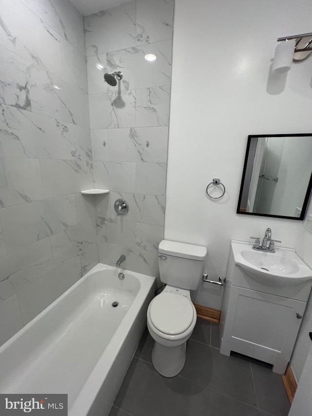 full bathroom with toilet, tiled shower / bath combo, vanity, and tile patterned floors