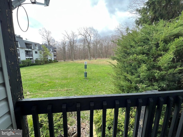 view of yard featuring a balcony