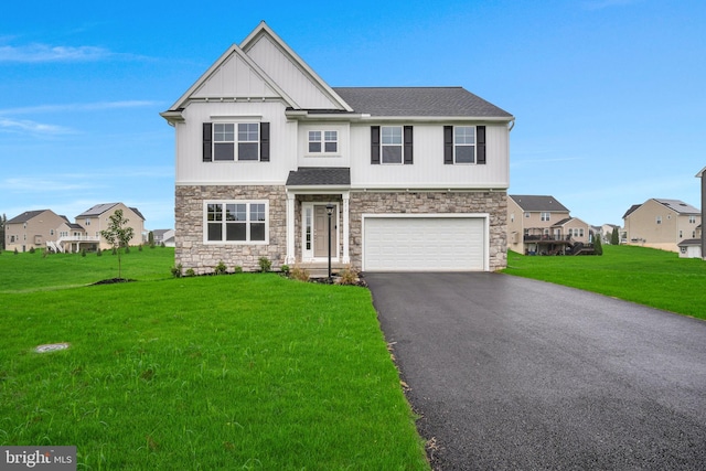 view of front of home featuring a garage and a front yard