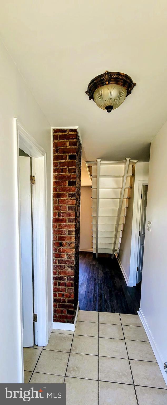 hall with wood-type flooring