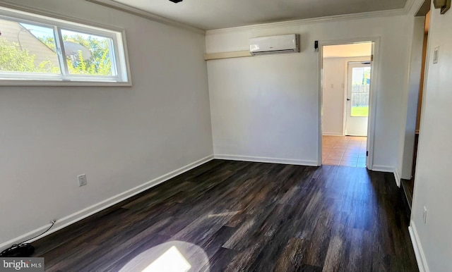 spare room with an AC wall unit, ceiling fan, dark hardwood / wood-style floors, and ornamental molding