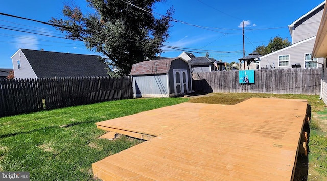 exterior space with a storage shed and a wooden deck