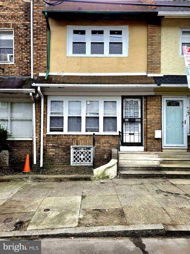 view of front of property featuring cooling unit