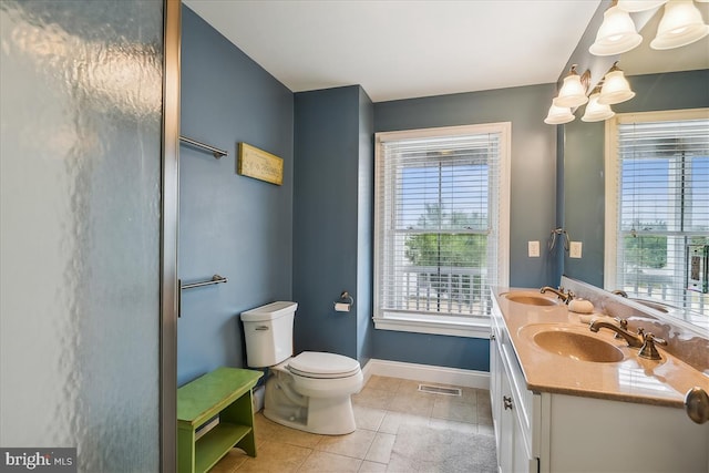 bathroom with tile patterned flooring, visible vents, a sink, and toilet