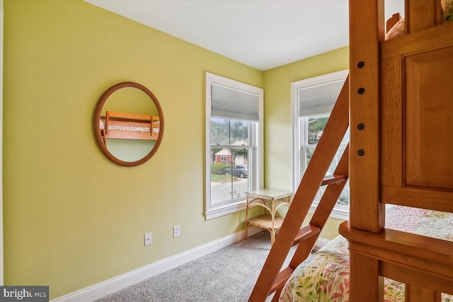 carpeted bedroom with baseboards