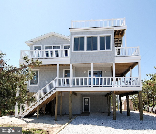 rear view of property with a carport