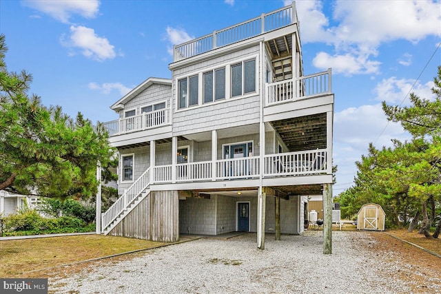 coastal home featuring a storage shed