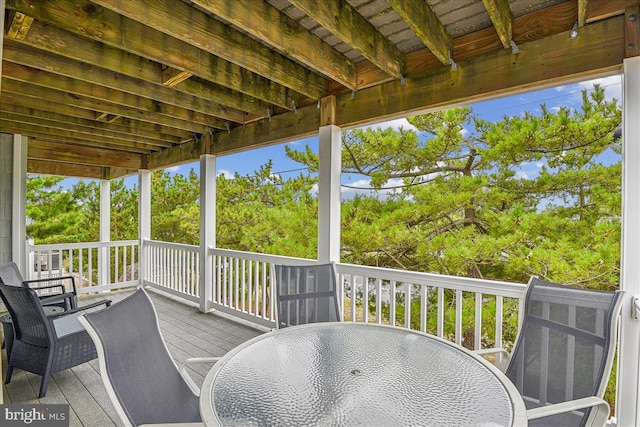 deck with outdoor dining area