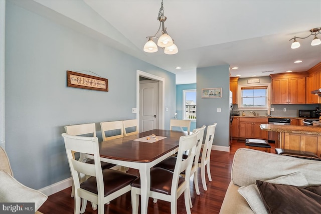 dining space featuring dark wood-style floors, recessed lighting, and baseboards