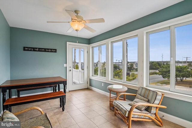 sunroom with a ceiling fan