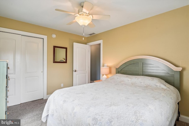 bedroom with carpet, a closet, visible vents, and a ceiling fan