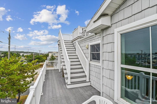 wooden terrace featuring stairway