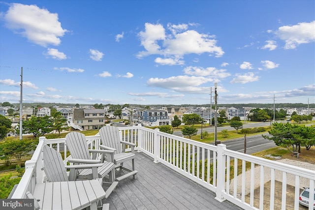 wooden terrace featuring a residential view