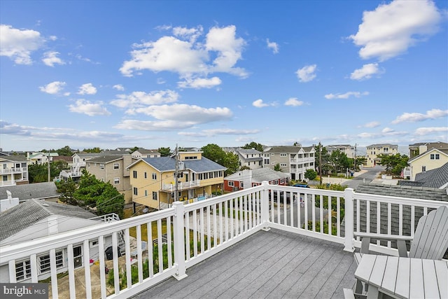 wooden deck with a residential view