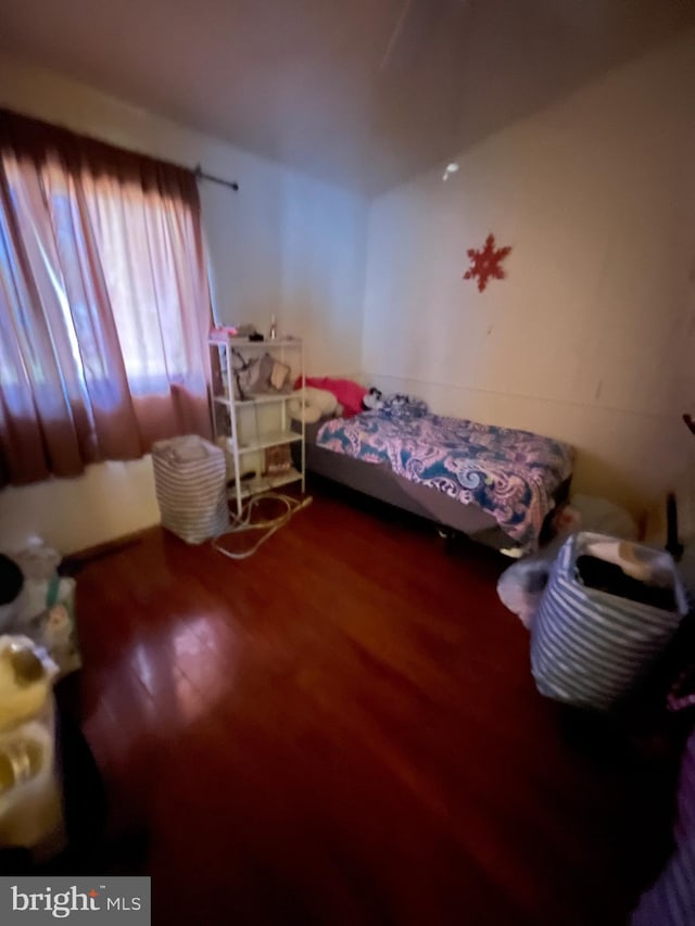 bedroom featuring wood-type flooring