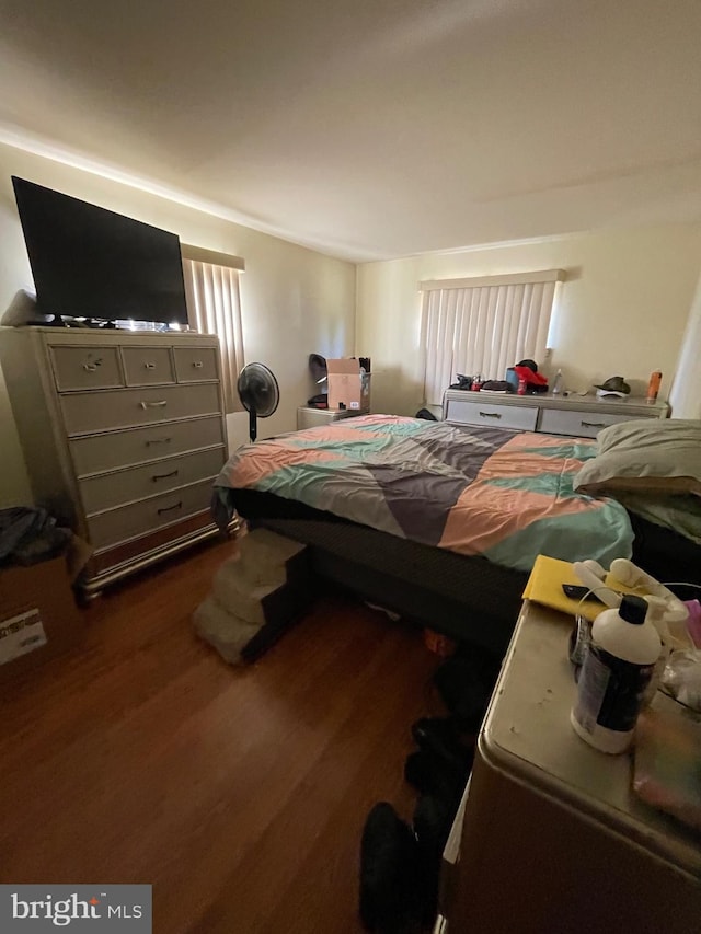 bedroom featuring dark hardwood / wood-style flooring