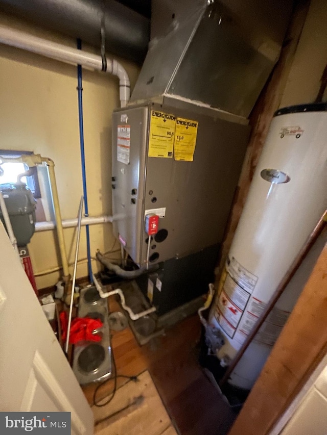 utility room featuring water heater