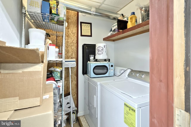 laundry area featuring washing machine and clothes dryer