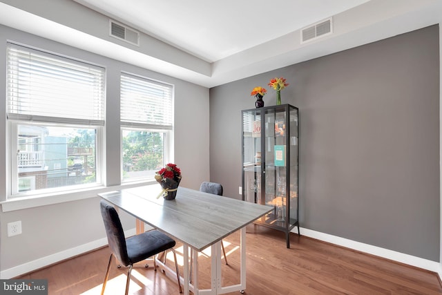 dining area with hardwood / wood-style floors