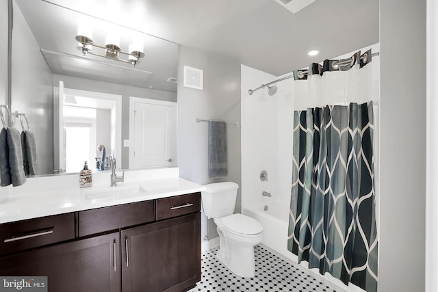 full bathroom with shower / tub combo, vanity, tile patterned flooring, and toilet