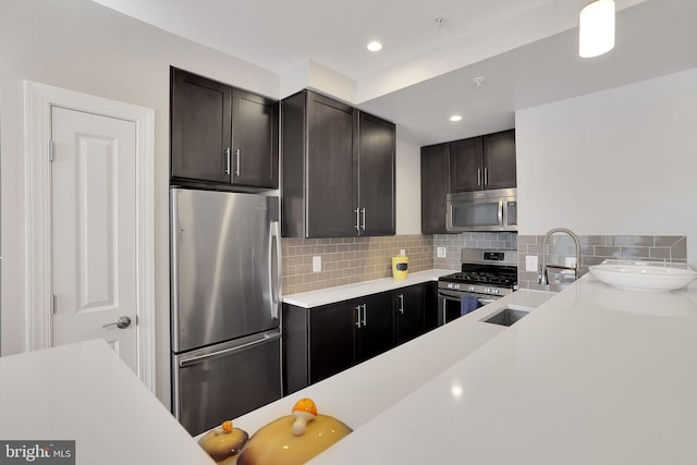 kitchen with stainless steel appliances, backsplash, dark brown cabinetry, and sink